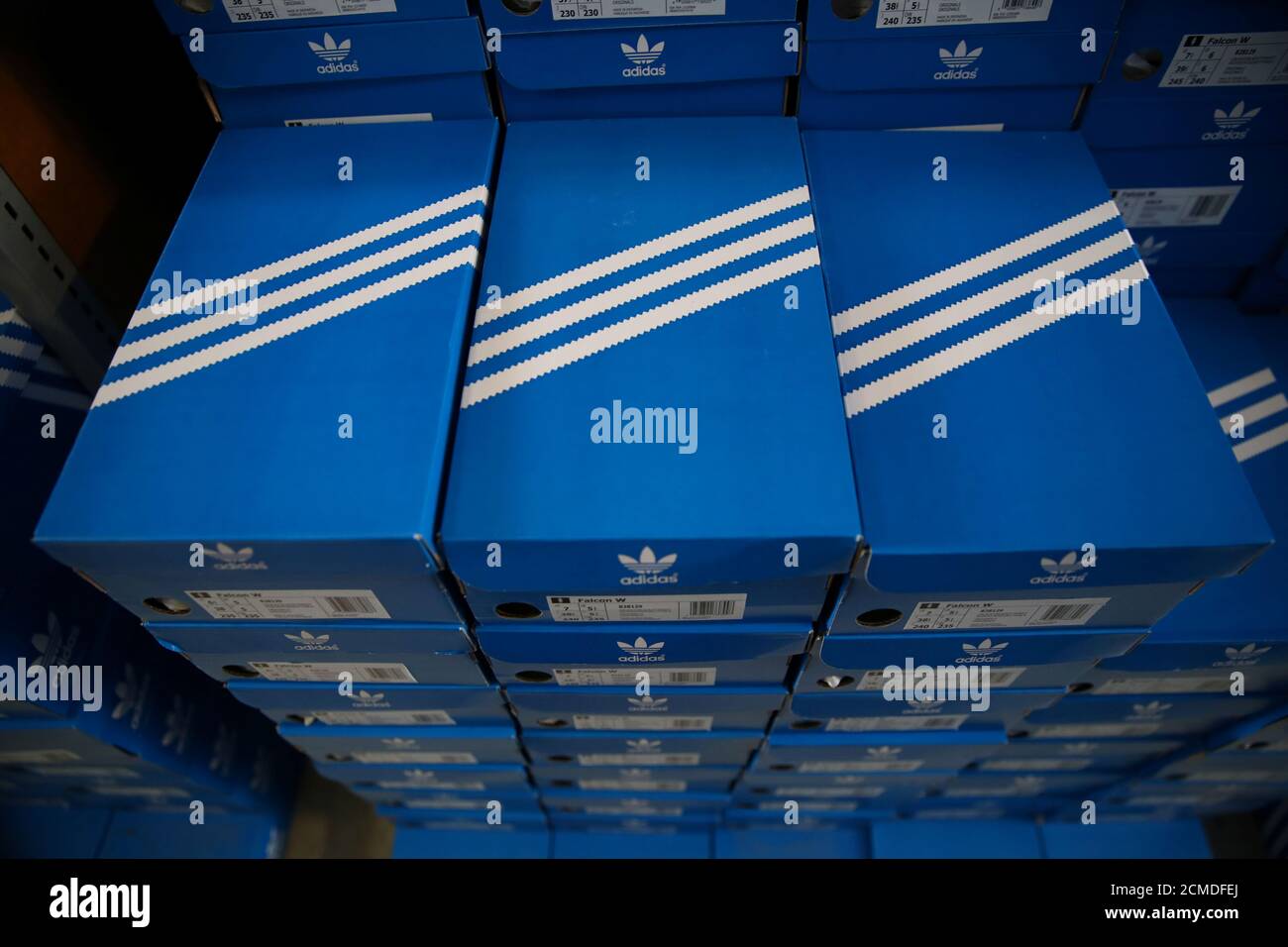Boxes of Adidas shoes are pictured in the warehouse of local footwear  retailer "Pomp It Up" in Bussigny near Lausanne, Switzerland 24 Aprill,  2019. REUTERS/Denis Balibouse Stock Photo - Alamy