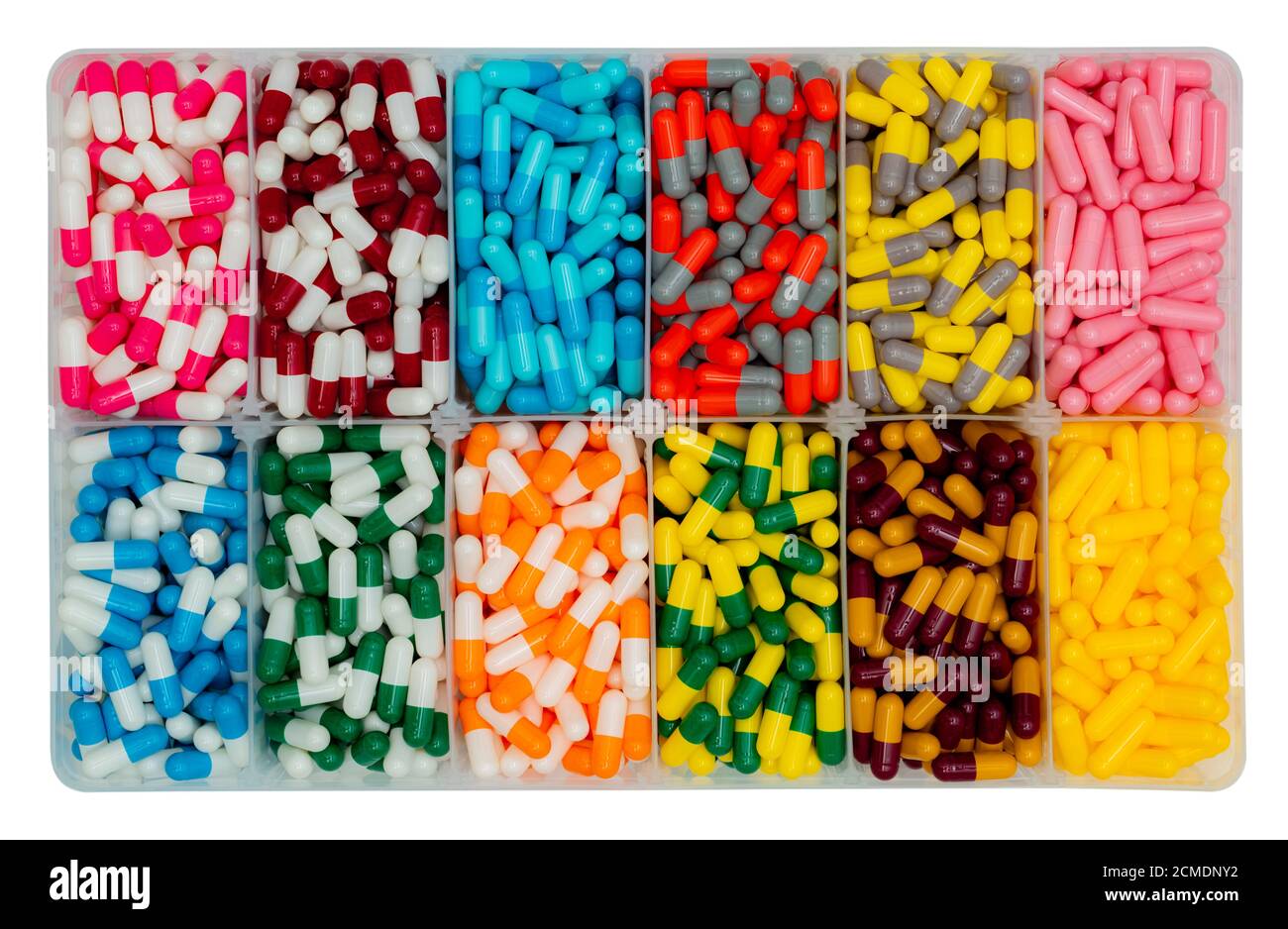 Top view of colorful capsule pills in  plastic box. Antibiotic drugs, painkiller medicine, vitamins, and supplements capsule pills. Pharmaceutical. Stock Photo