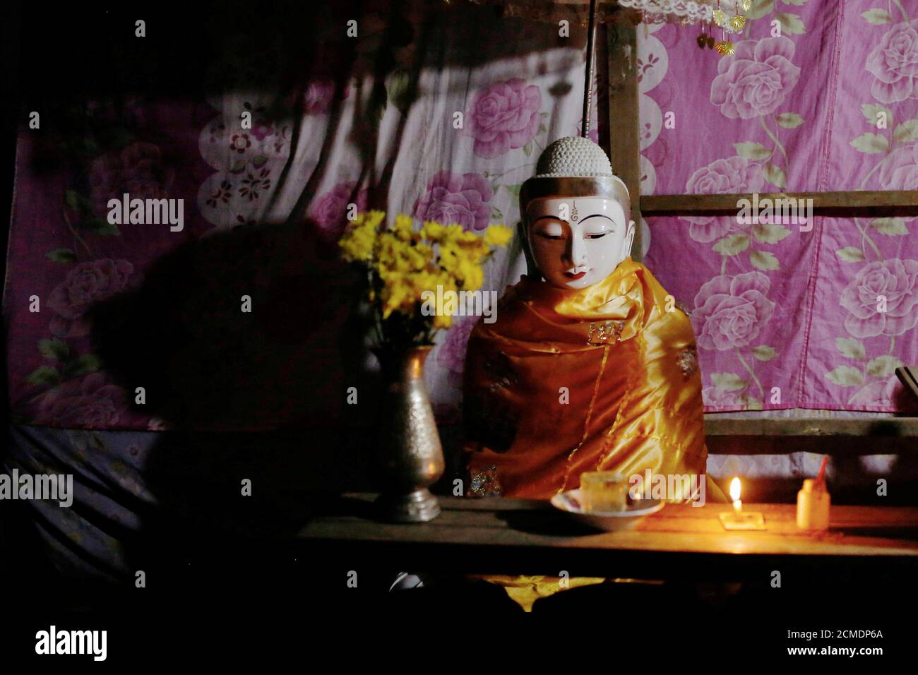 A Buddhist statue is seen at a temporary shelter after a monastery collapsed into a river in Ta Dar U village, Bago, Myanmar, February 5, 2020. Photo taken on February 5, 2020. REUTERS/Ann Wang Stock Photo