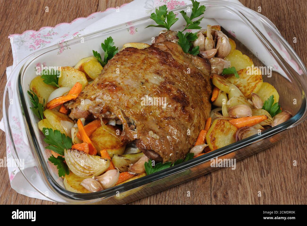 Turkey thigh baked with vegetables Stock Photo