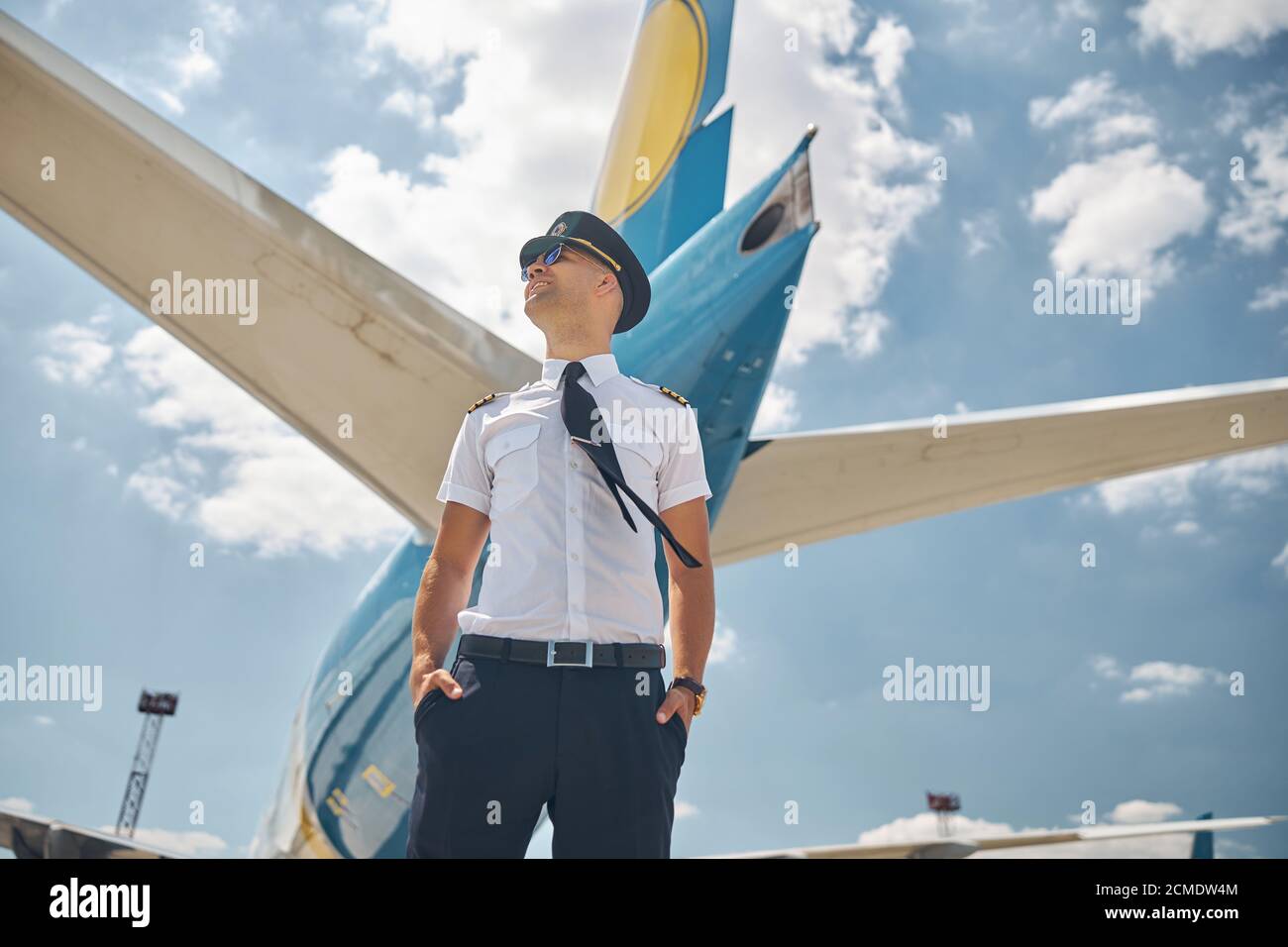 Joyful aircraft pilot standing hi-res stock photography and images - Alamy