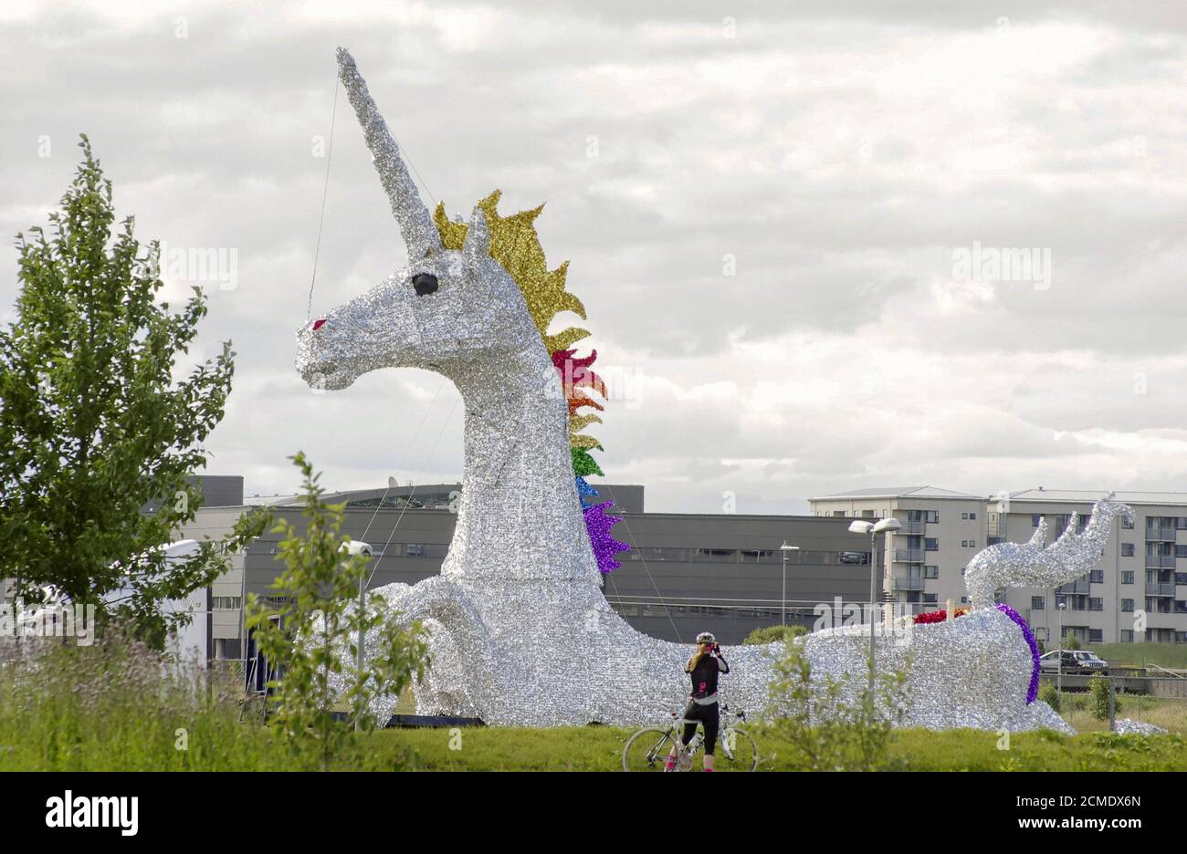 A float with a giant unicorn is seen 