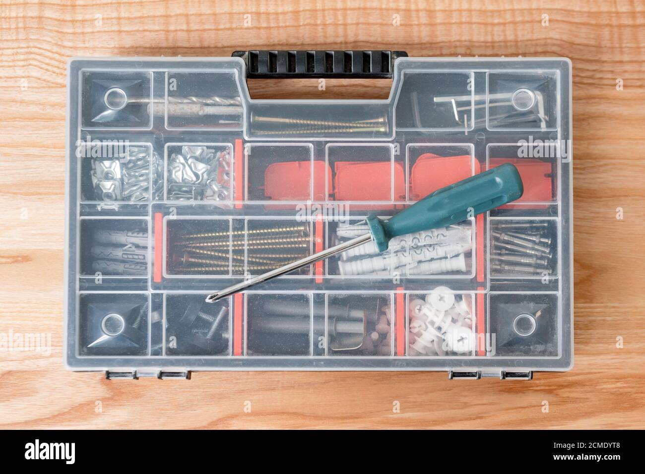 Toolbox with different instruments. Screws and screwdriver Plactic box ...