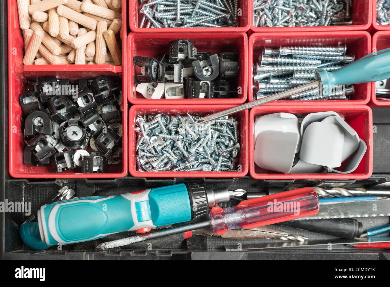 Toolbox with different instruments. Screws and screwdriver Plactic box