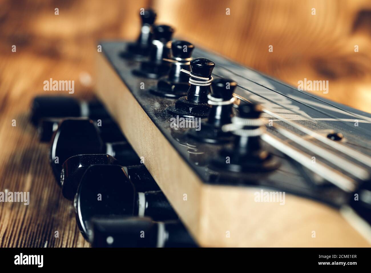 Guitar headstock with tuners on dark background Stock Photo Alamy