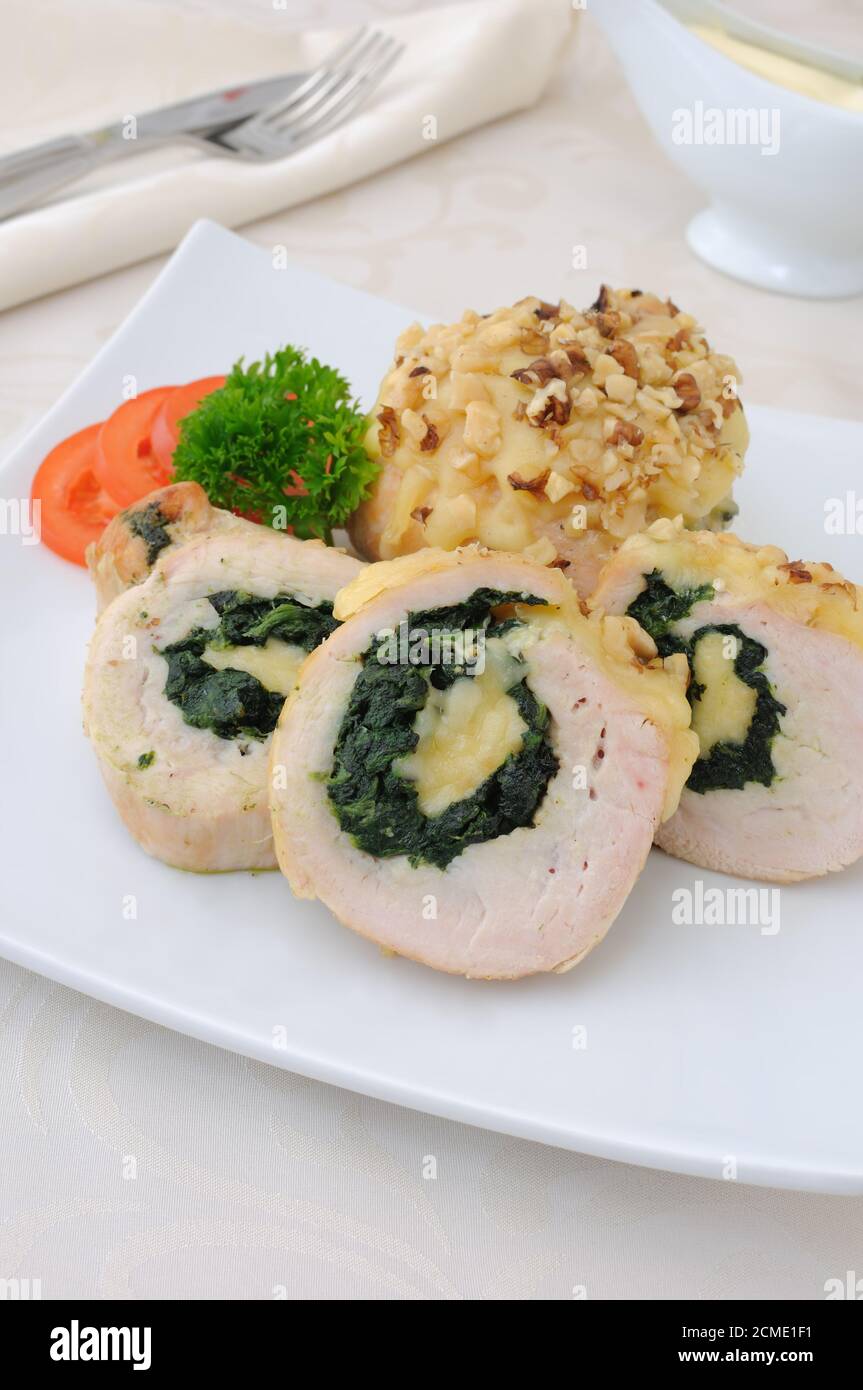 Chicken roulade stuffed with spinach and cheese Stock Photo Alamy