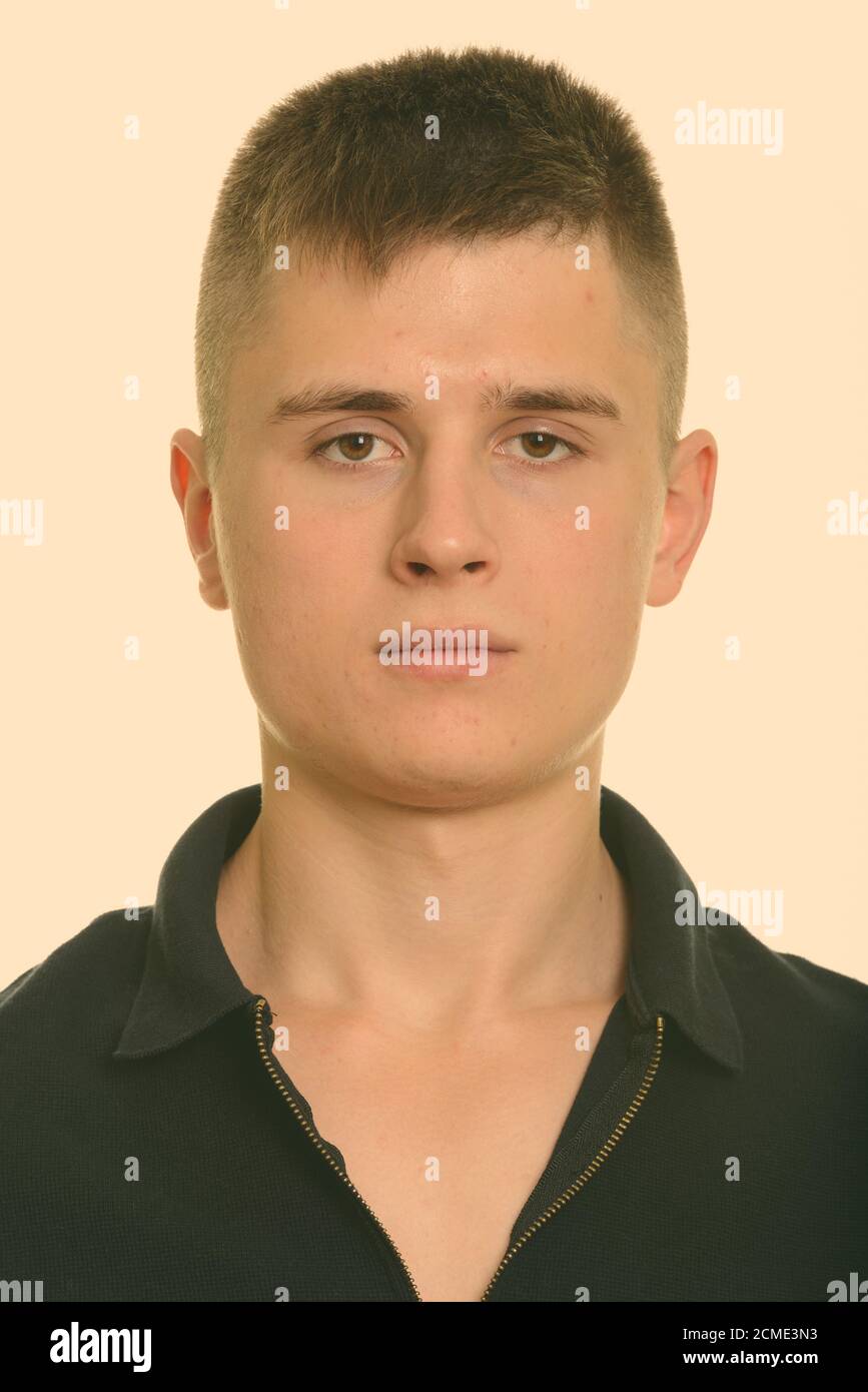 Portrait of young handsome man looking at camera Stock Photo - Alamy