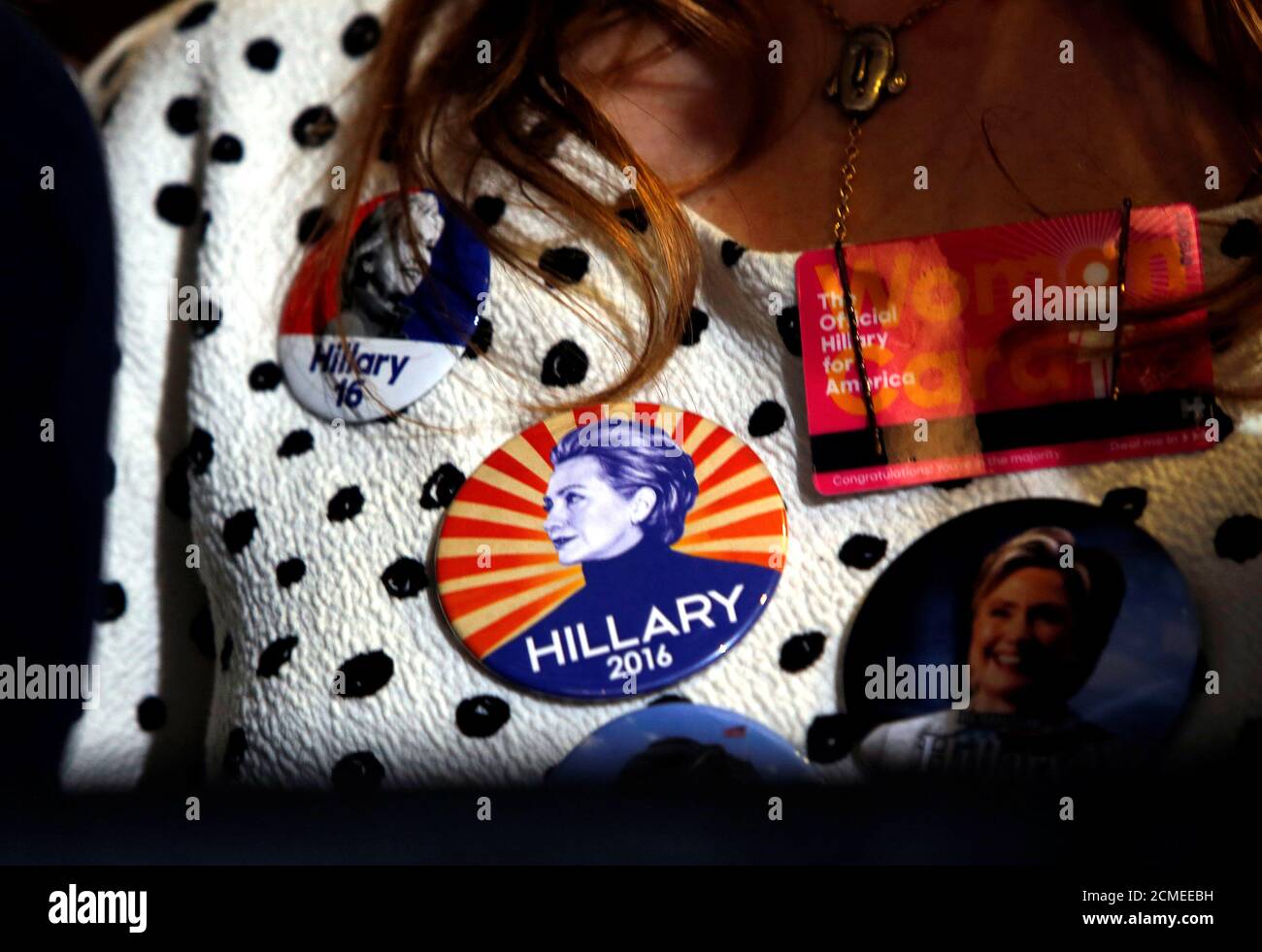 A supporter wears Democratic U.S. presidential nominee Hillary Clinton buttons during a Clinton campaign rally at the International Brotherhood of Electrical Workers (IBEW), Local 357, union hall in Las Vegas, Nevada, U.S., August 4, 2016. REUTERS/Steve Marcus Stock Photo