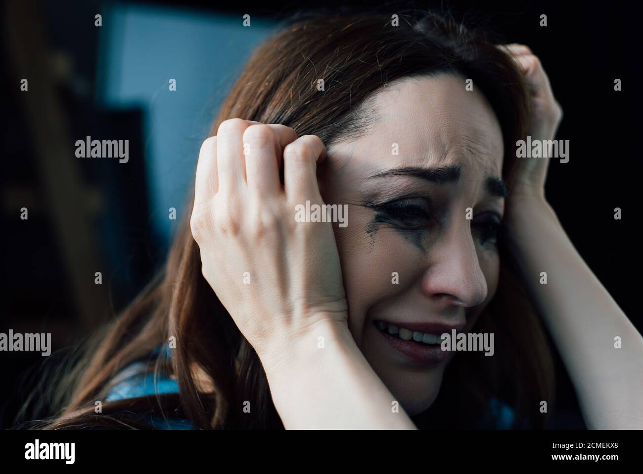 upset woman with flowed mascara crying at home Stock Photo Alamy
