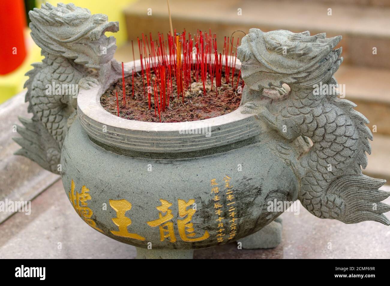 Burning Incense sticks in joss-stick pot in a chinese buddhism temple in Penang, Malaysia Stock Photo