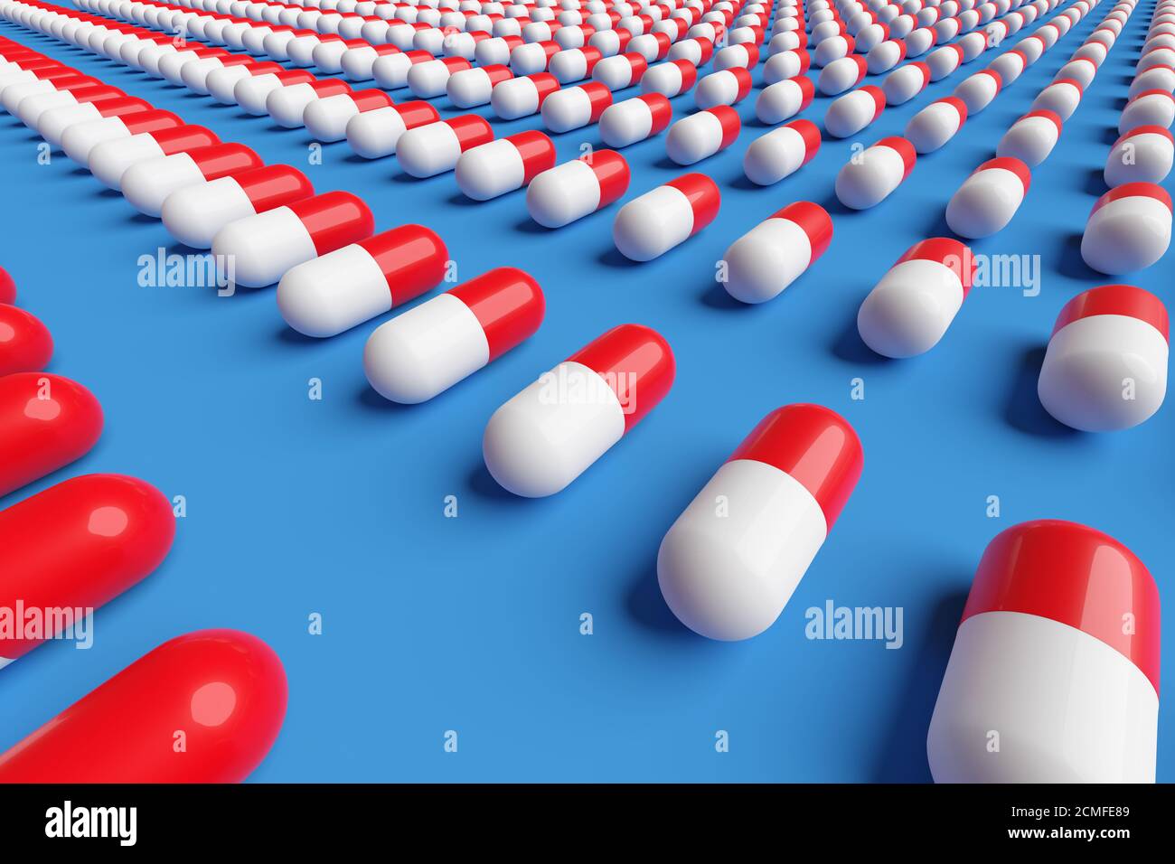 Red and white pills on a blue background. 3d illustration. Stock Photo
