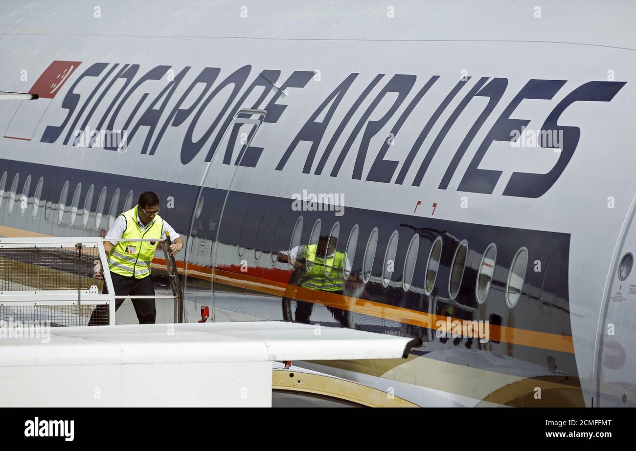 An airport operations crew member prepares to board the first of 67 new