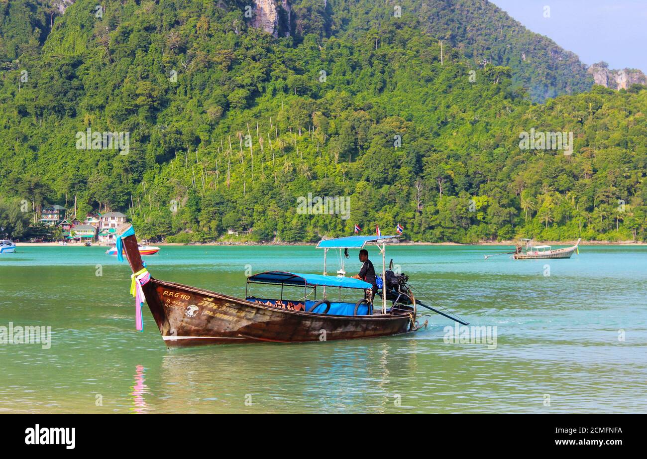 KRABI, PHIPHI, THAILAND - NOVEMBER 29, 2013: a Longtrail boat on Loh samah bay at island. Stock Photo