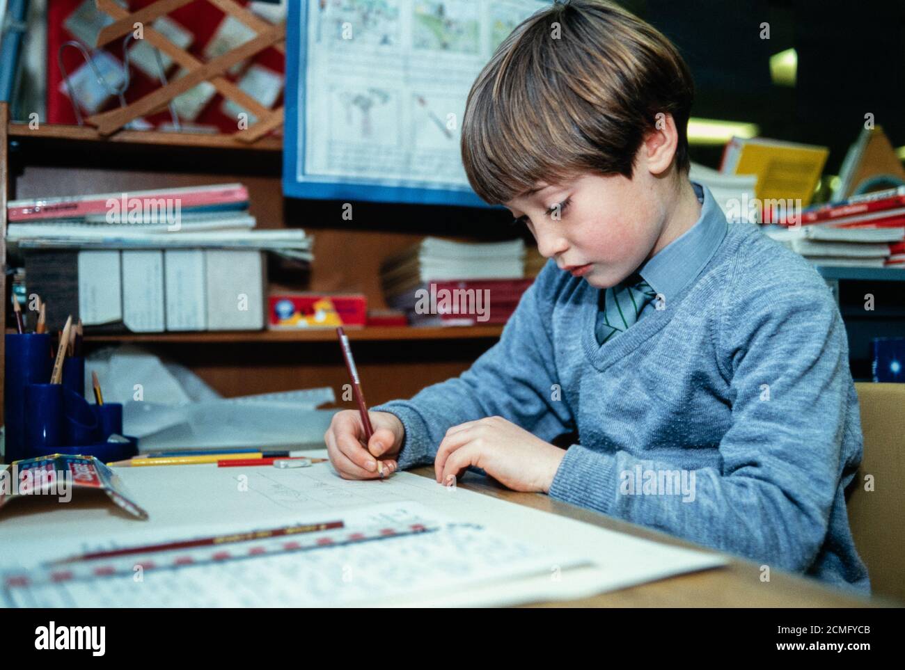 A boy working in a classroom at Cottenham Park Primary School in Raynes