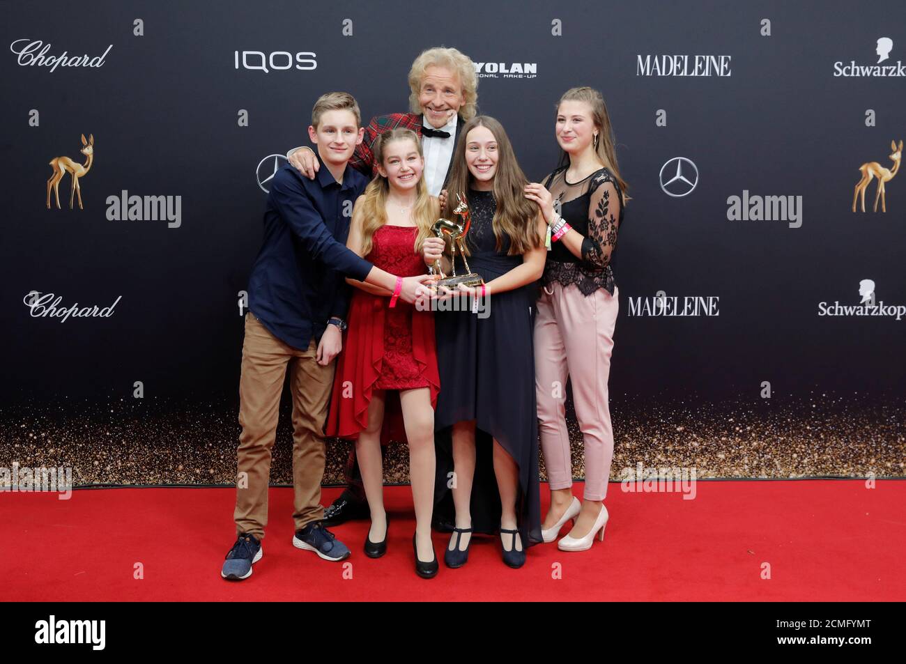 German TV presenter Thomas Gottschalk poses with winners of the 'Our Future' award Magdalena Kist, Jule Albrecht, Helena Back and Claudio Waldele at the Bambi 2019 Awards ceremony in Baden-Baden, Germany, November 21, 2019. REUTERS/Arnd Wiegmann Stock Photo