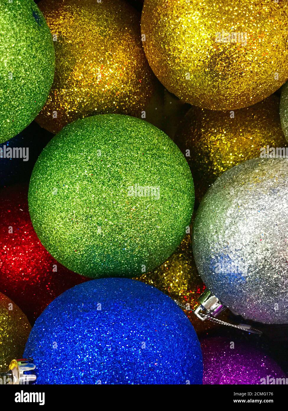Shiny Christmas decorations in different colors Stock Photo - Alamy