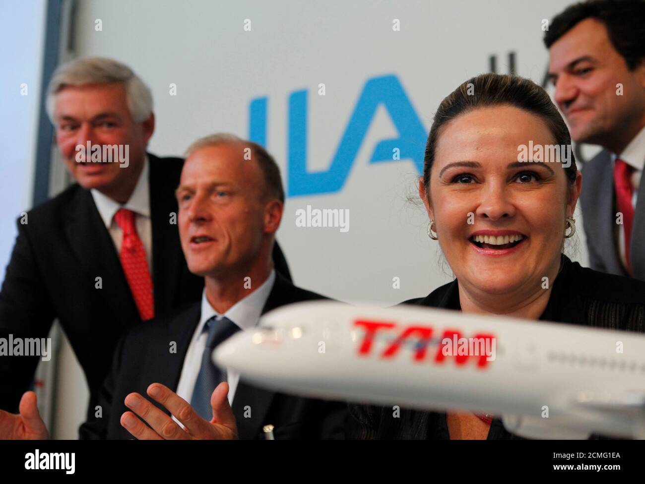 Airbus President and Chief Executive Tom Enders (2nd L) and Airbus Chief Operating Officer John Leahy (L) attend a news conference with Maria Claudia Amaro (2nd R) and Libano Barroso of Brazilian carrier TAM after signing documents at the ILA International Air Show in Schoenefeld outside Berlin, June 8, 2010. Brazil's largest air carrier, is poised to order Airbus aircraft worth just under $3 billion at the Berlin air show on Tuesday, a source familiar with the deal told Reuters.  REUTERS/Thomas Peter  (GERMANY - Tags: TRANSPORT BUSINESS) Stock Photo