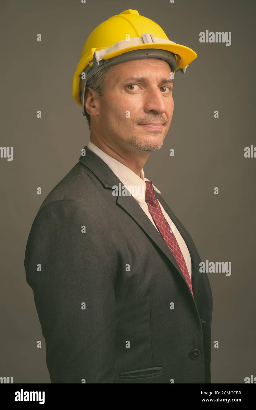Portrait of businessman as engineer with hardhat Stock Photo
