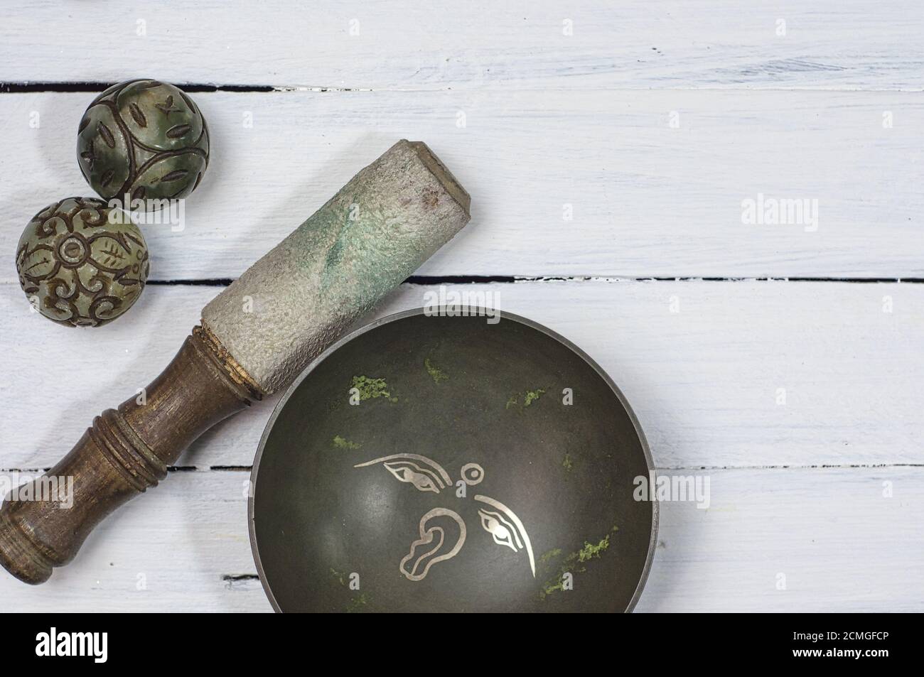 Copper Tibetan singing bowl with stone balls to religious rituals Stock