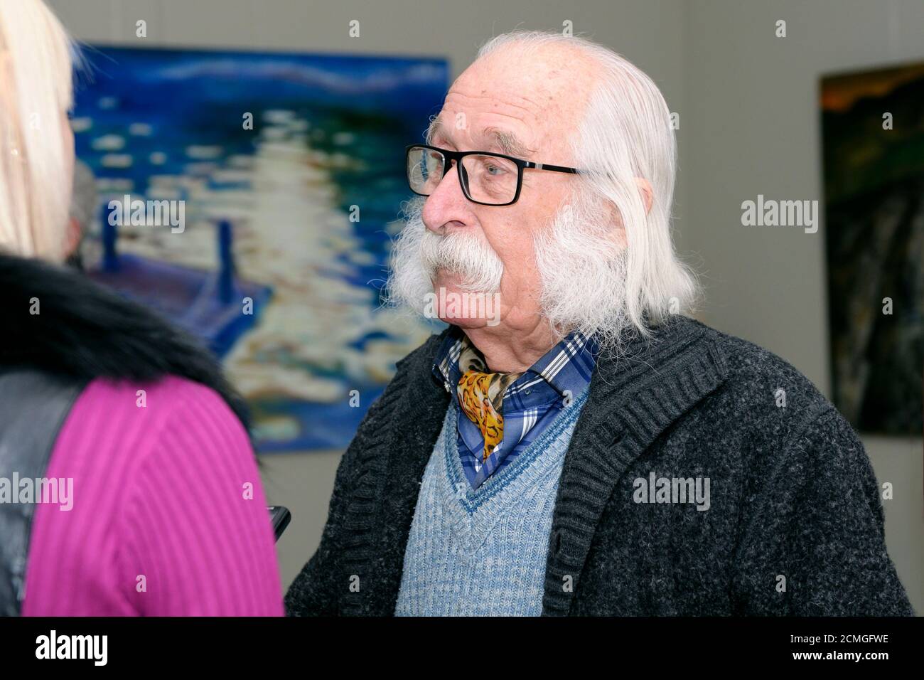 Famous Ukrainian painter Ivan Marchuk giving an interview during his solo exhibition Stock Photo