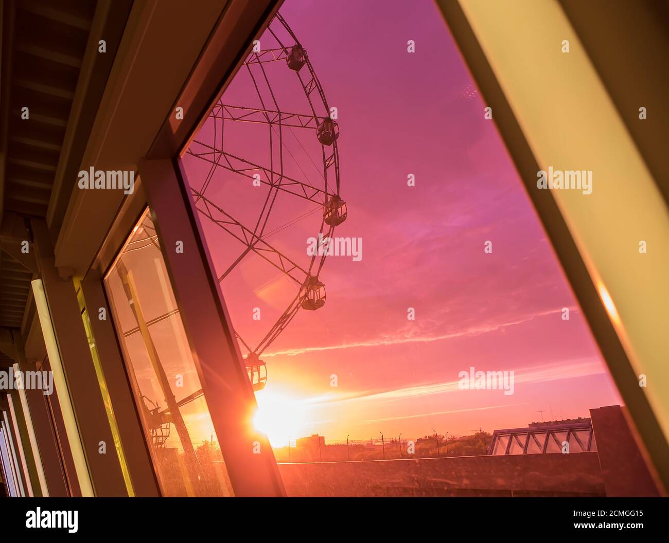 Ferris wheel on sunset background Stock Photo - Alamy