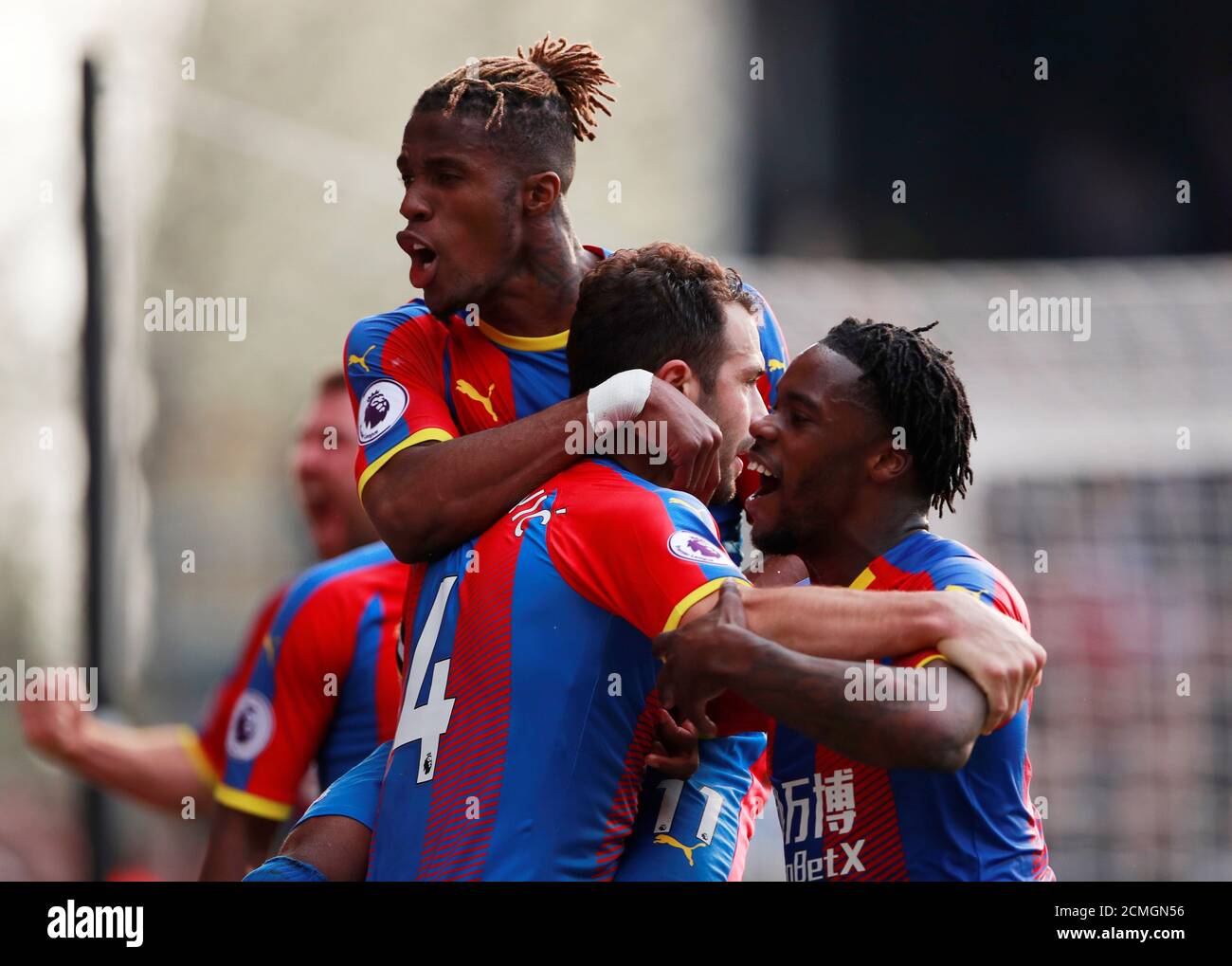 Soccer Football - Premier League - Crystal Palace v Huddersfield Town - Selhurst Park, London, Britain - March 30, 2019  Crystal Palace's Luka Milivojevic celebrates scoring their first goal with team mates    Action Images via Reuters/Andrew Couldridge  EDITORIAL USE ONLY. No use with unauthorized audio, video, data, fixture lists, club/league logos or 'live' services. Online in-match use limited to 75 images, no video emulation. No use in betting, games or single club/league/player publications.  Please contact your account representative for further details. Stock Photo
