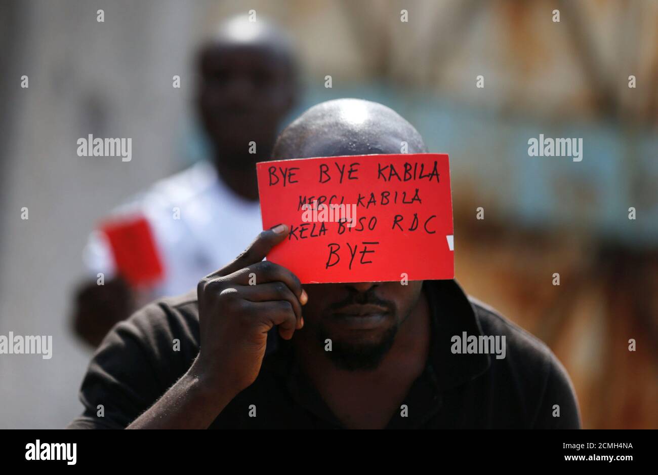 A Congolese opposition party supporter displays a red card against President Joseph Kabila in Kinshasa, Democratic Republic of Congo December 19, 2016. REUTERS/Thomas Mukoya     TPX IMAGES OF THE DAY Stock Photo