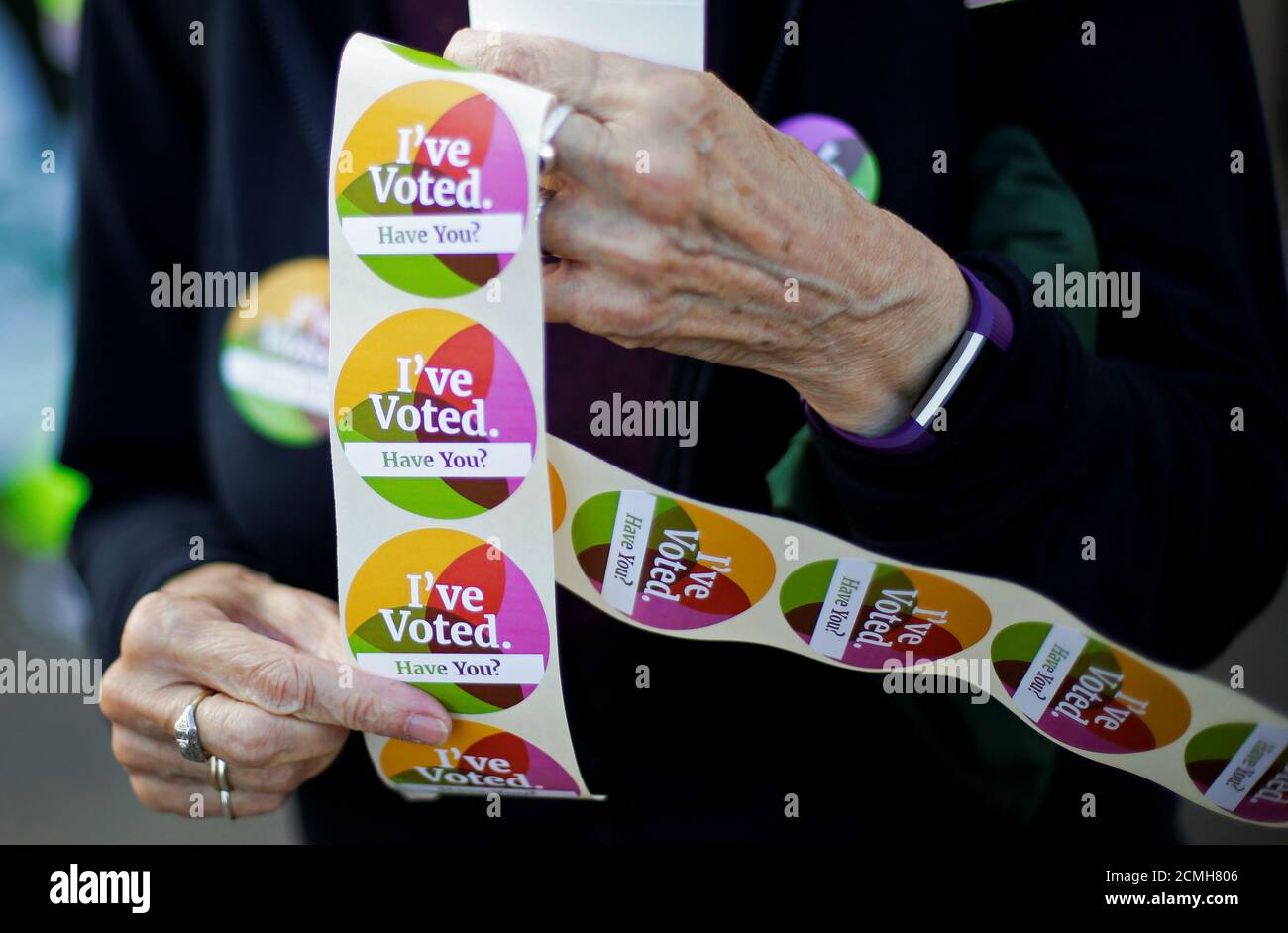 A woman holds stickers as Ireland holds a referendum on iberalising abortion laws, in Dublin, Ireland, May 25, 2018. REUTERS/Max Rossi Stock Photo
