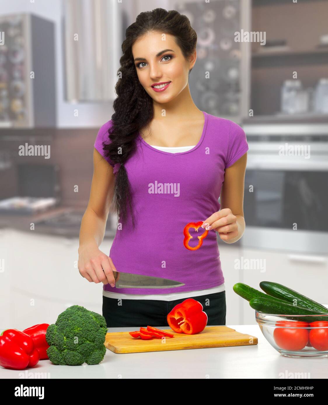 Young cooking woman in the kitchen Stock Photo