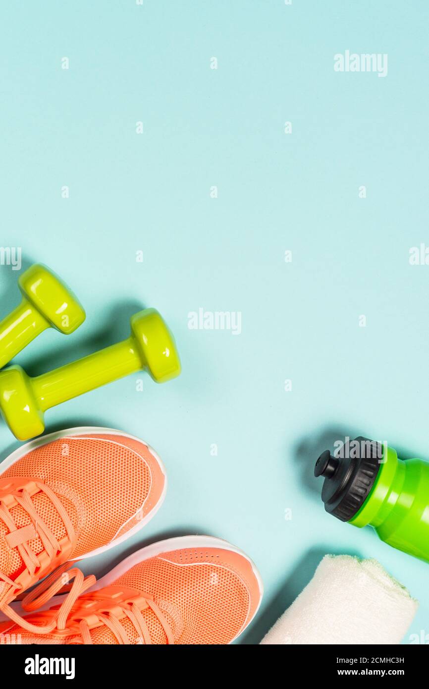 Fitness equipment at blue background top view. Stock Photo