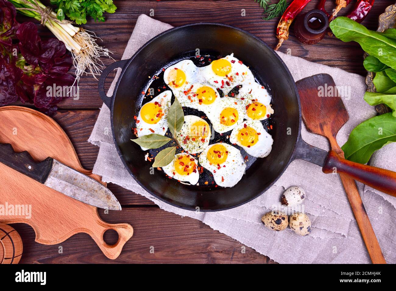 Fried quail eggs in a frying pan Stock Photo