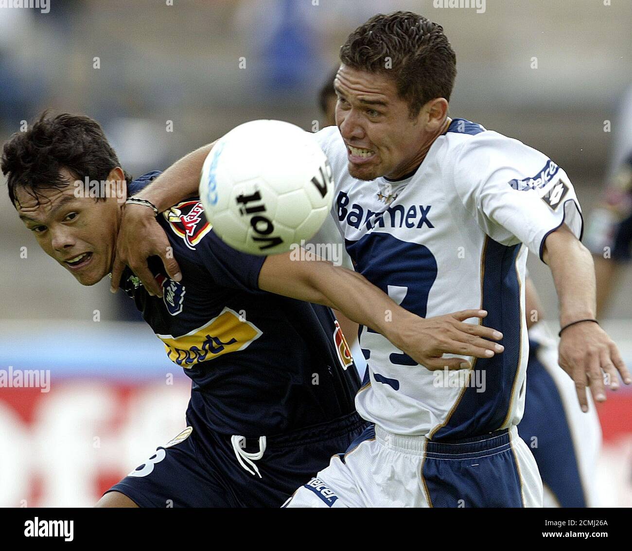 Pumas midfielder Gerardo Galindo (R) battles for the ball with Dorados  defender Joel Sanchez during the first half of their Mexican league  championship match, in Mexico City, October 3, 2004. REUTERS/Henry Romero