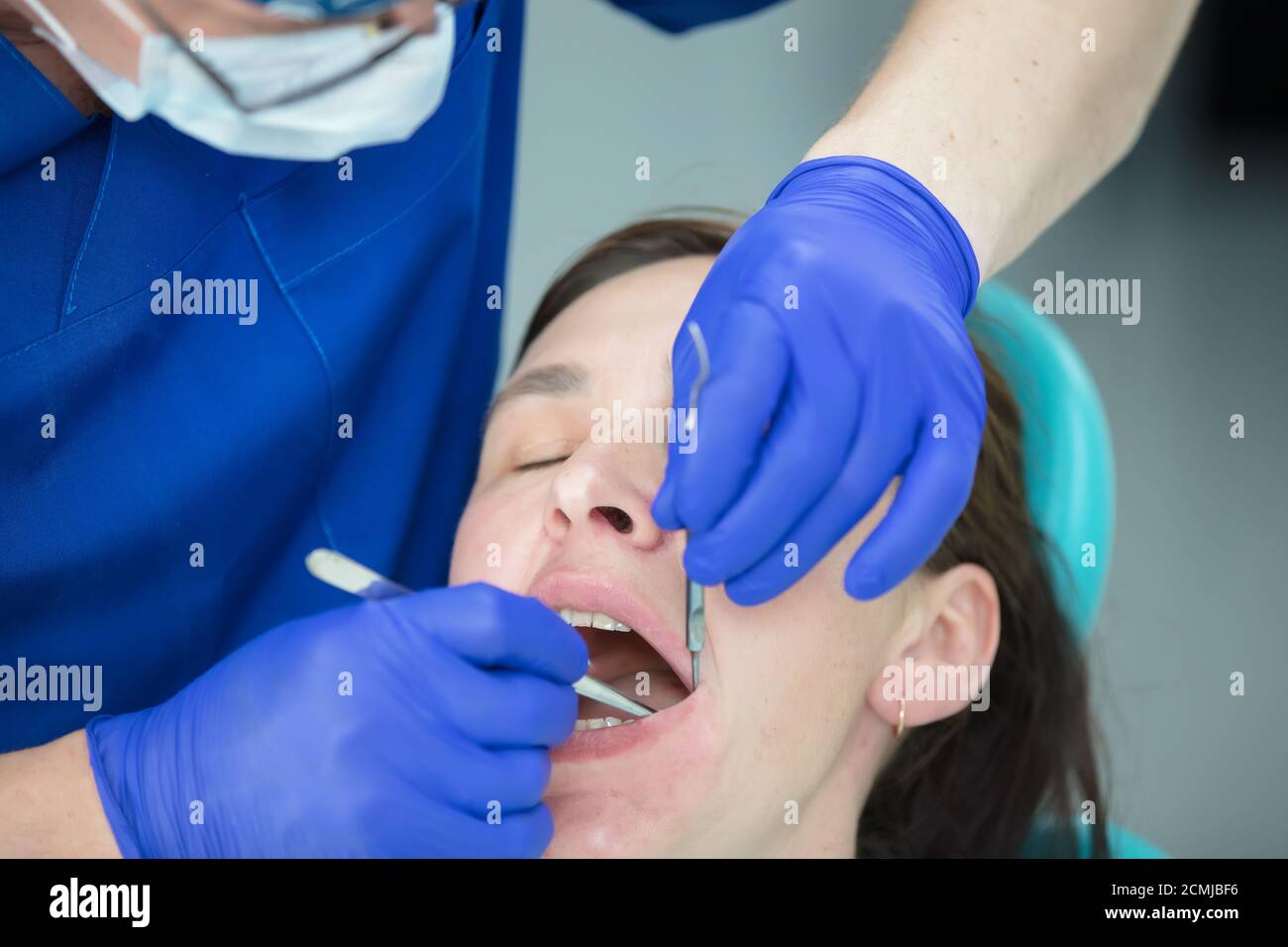 Dental treatment. Dental office. Doctor treats teeth. Woman in dentistry.Dental treatment