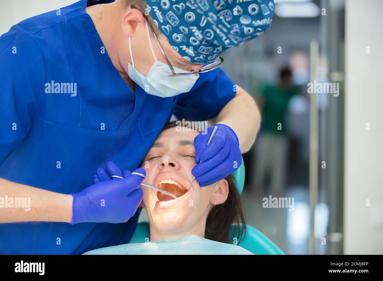 Dental treatment. Dental office. Doctor treats teeth. Woman in dentistry.Dental treatment
