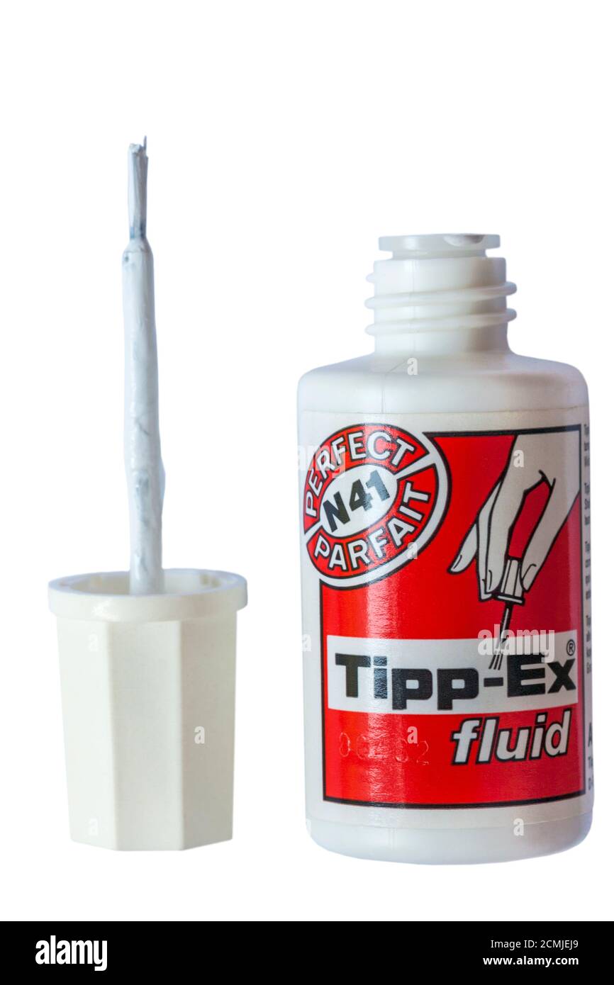 Tipp-Ex fluid Tippex with top and brush removed isolated on white background Stock Photo