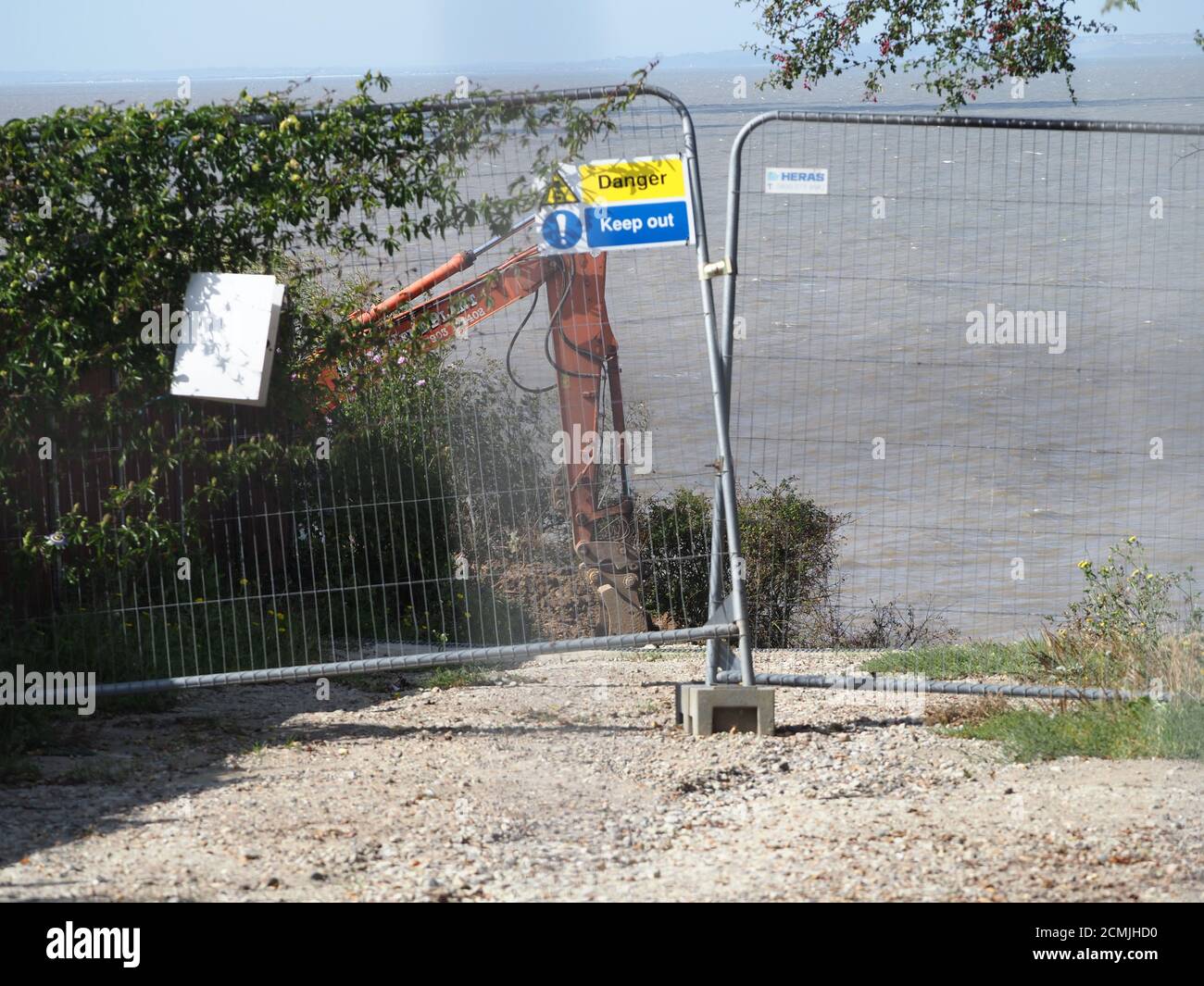 Eastchurch, Kent, UK. 17th September, 2020. Eastchurch Gap residents - where a house went over the cliff earlier this year - are now attempting to 'hold back the tide' by filling in the area the house collapsed into themselves. An excavator was seen working on the cliff edge, and a contractor is being employed by the residents to delay further erosion, with the project being managed by resident Malcolm Newell who is chairman of the Eastchurch Gap Erosion and Community Action Group. Credit: James Bell/Alamy Live News Stock Photo