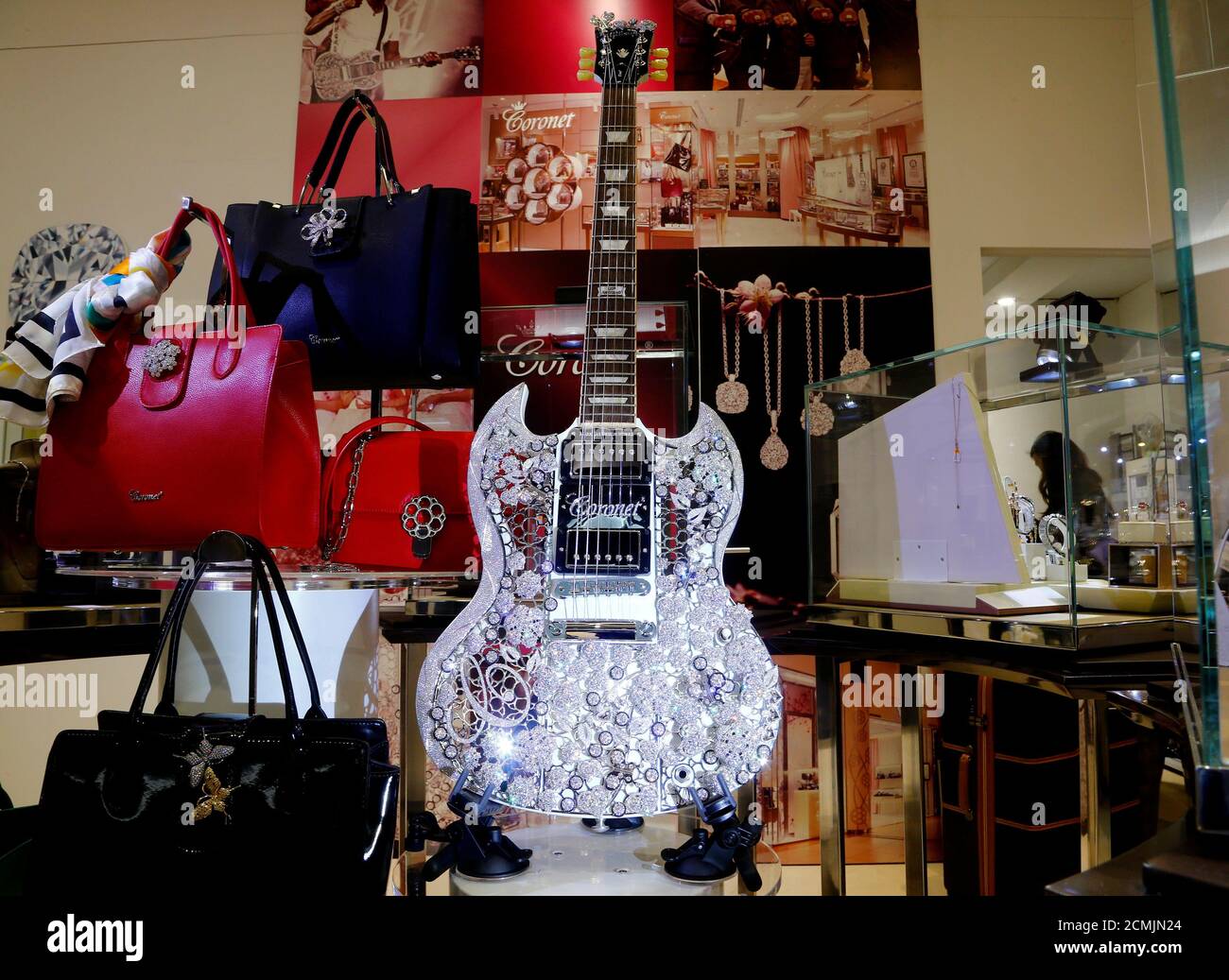 An Eden of Coronet, a Gibson SG guitar adorned with more than 400 carat  diamonds and about 1.6 kilograms of 18k gold of Hong Kong jewellery  manufacturers Aaron Shum is displayed at
