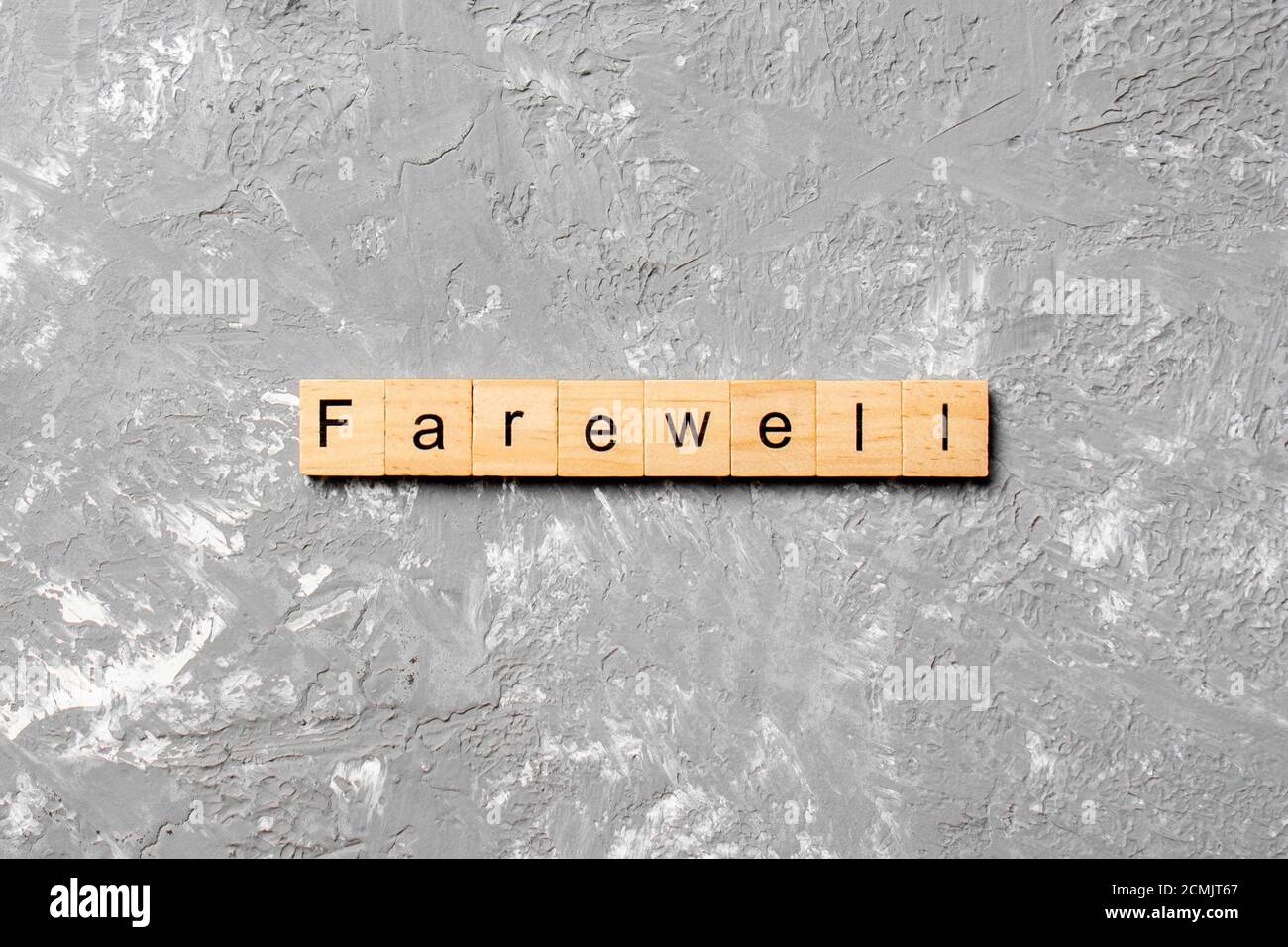 farewell word written on wood block. farewell text on table, concept. Stock Photo