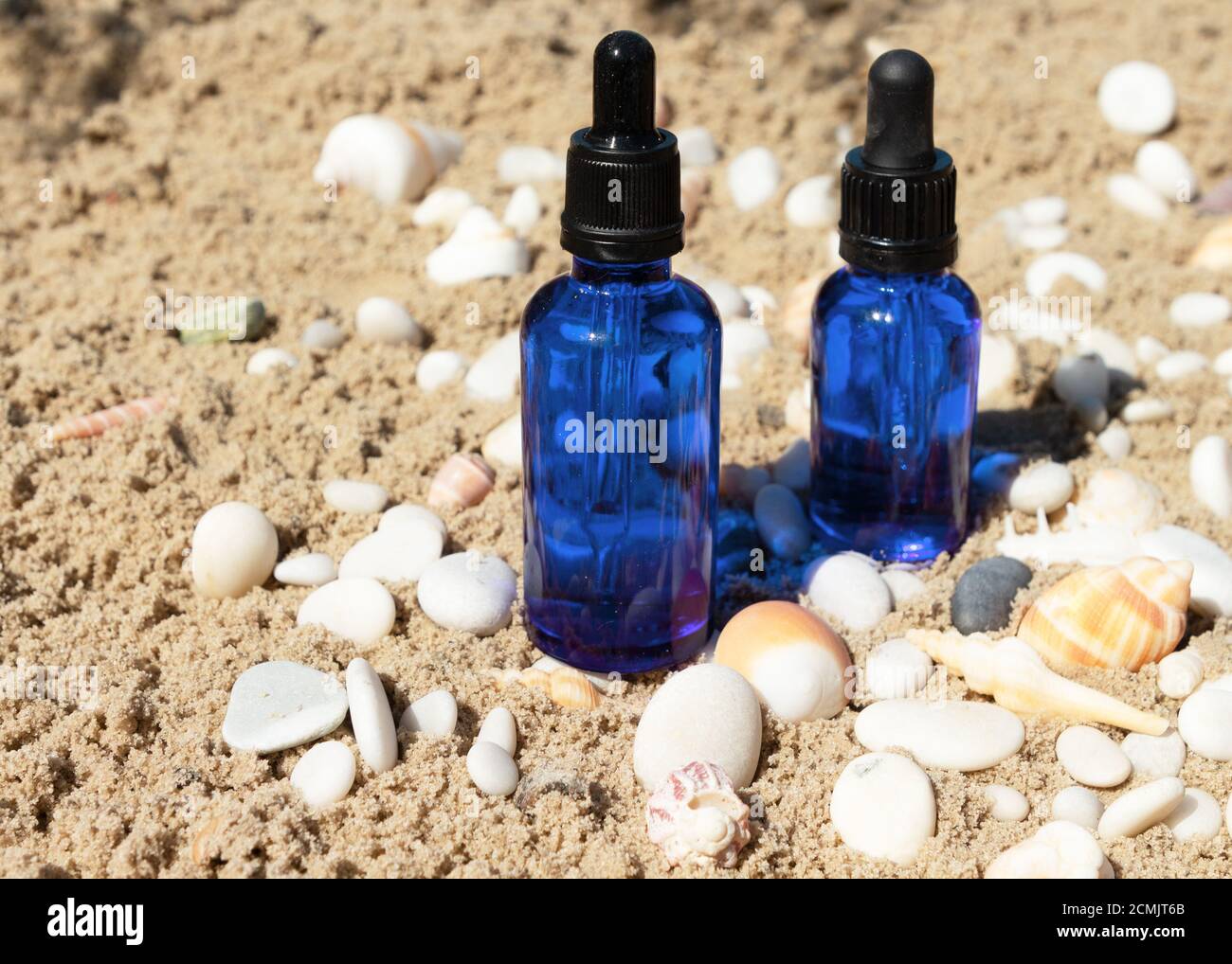 Natural cosmetic skincare bottle container from blue glass with a