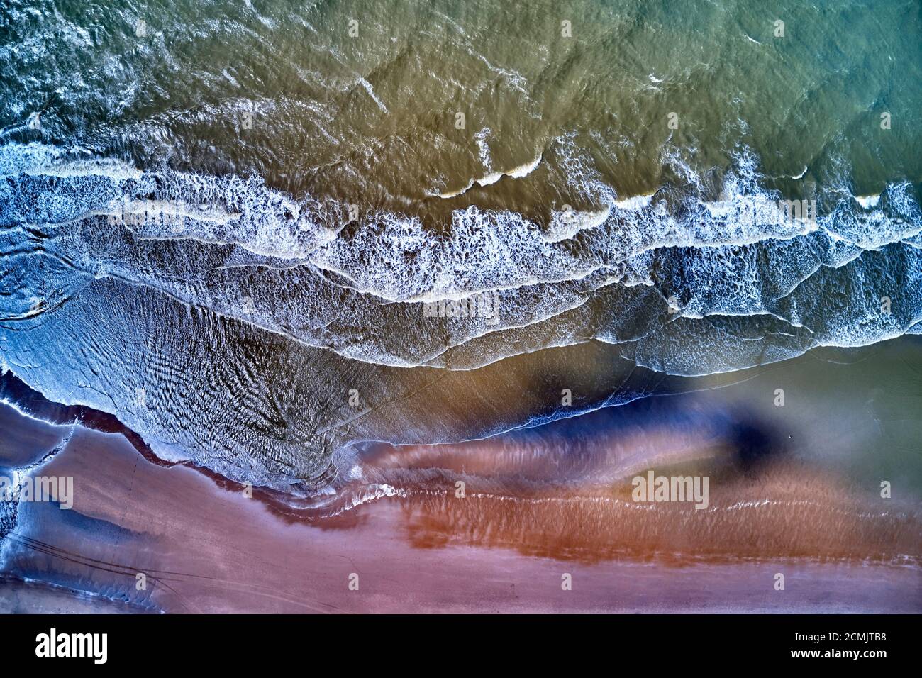 Aerial view of sea waves and sandy beach above the beach of zandvoort netherlands Stock Photo
