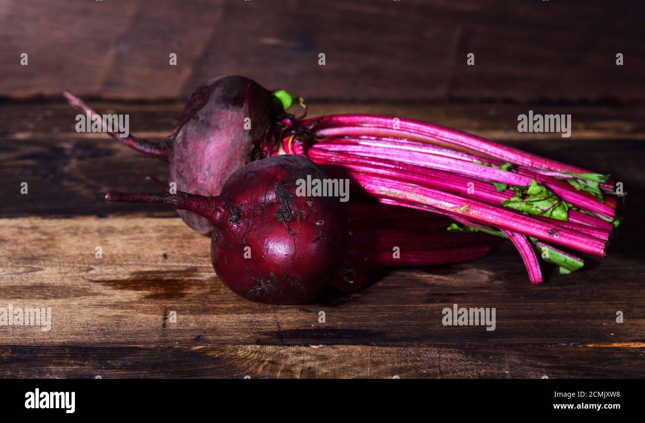 Two whole fresh beets with a tops Stock Photo