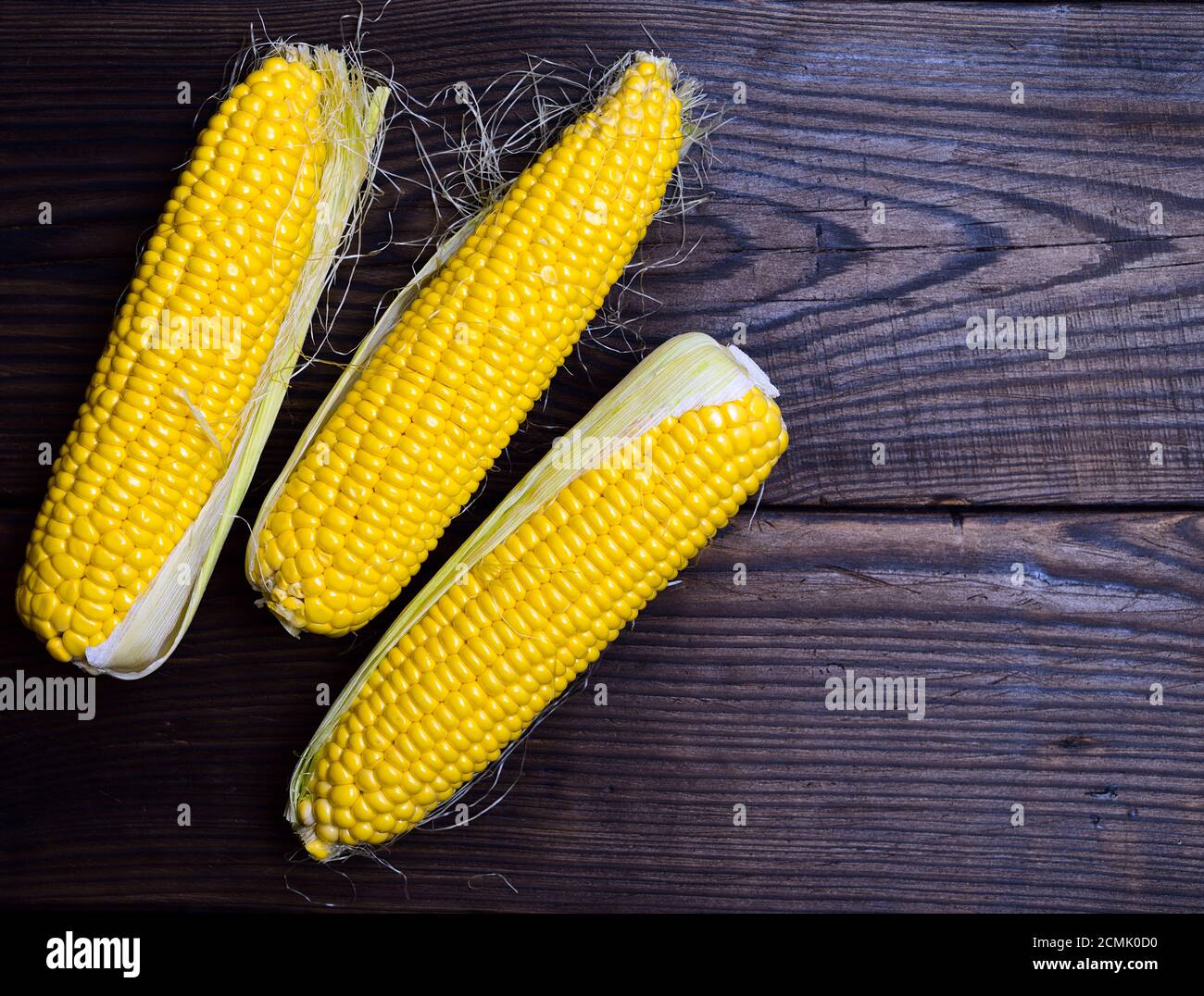 Three yellow corn cobs Stock Photo