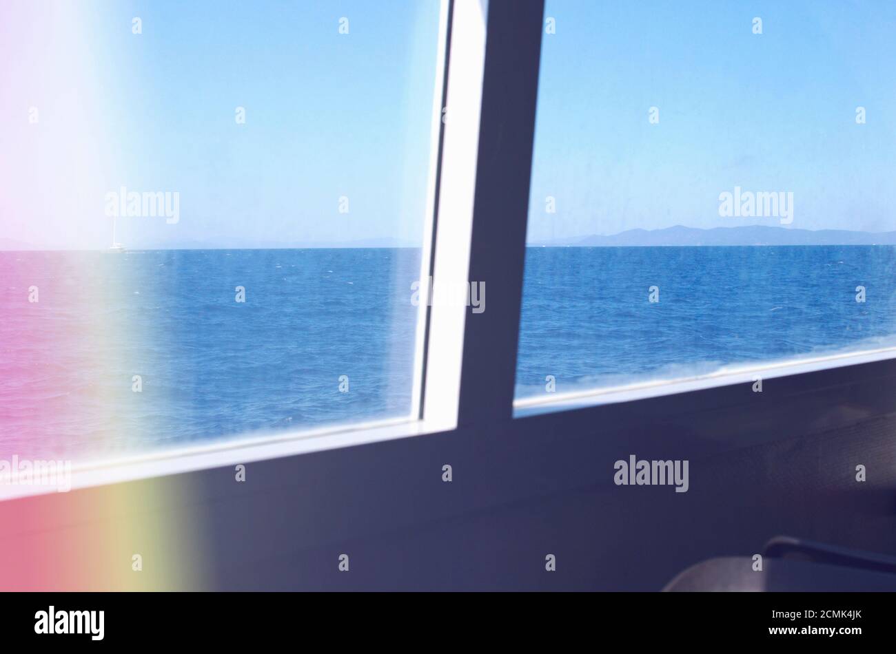 ferry window view with light leaking Stock Photo