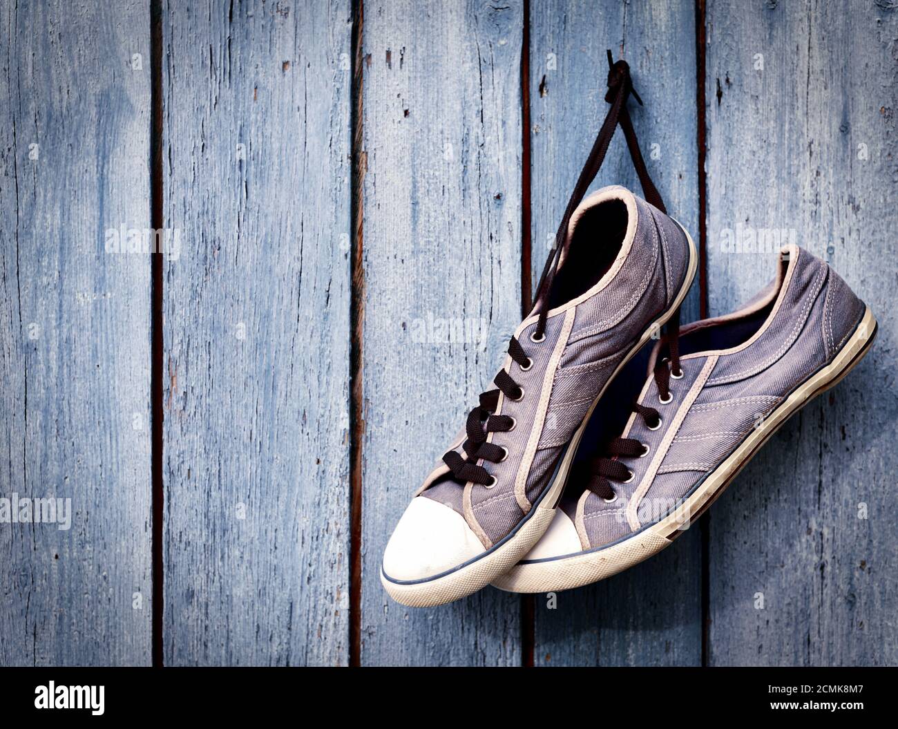 pair of old man's dirty blue sneakers Stock Photo