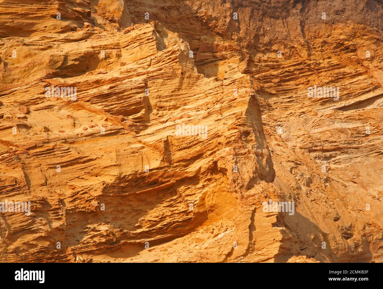 Detail of stratified Middle Pleistocene glacial sands in cliffs on the North Norfolk coast at Happisburgh, Norfolk, England, United Kingdom. Stock Photo