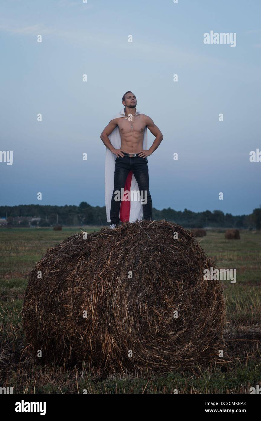 A Belarusian protester with a white red and white flag on his back, a hero of the protests Stock Photo