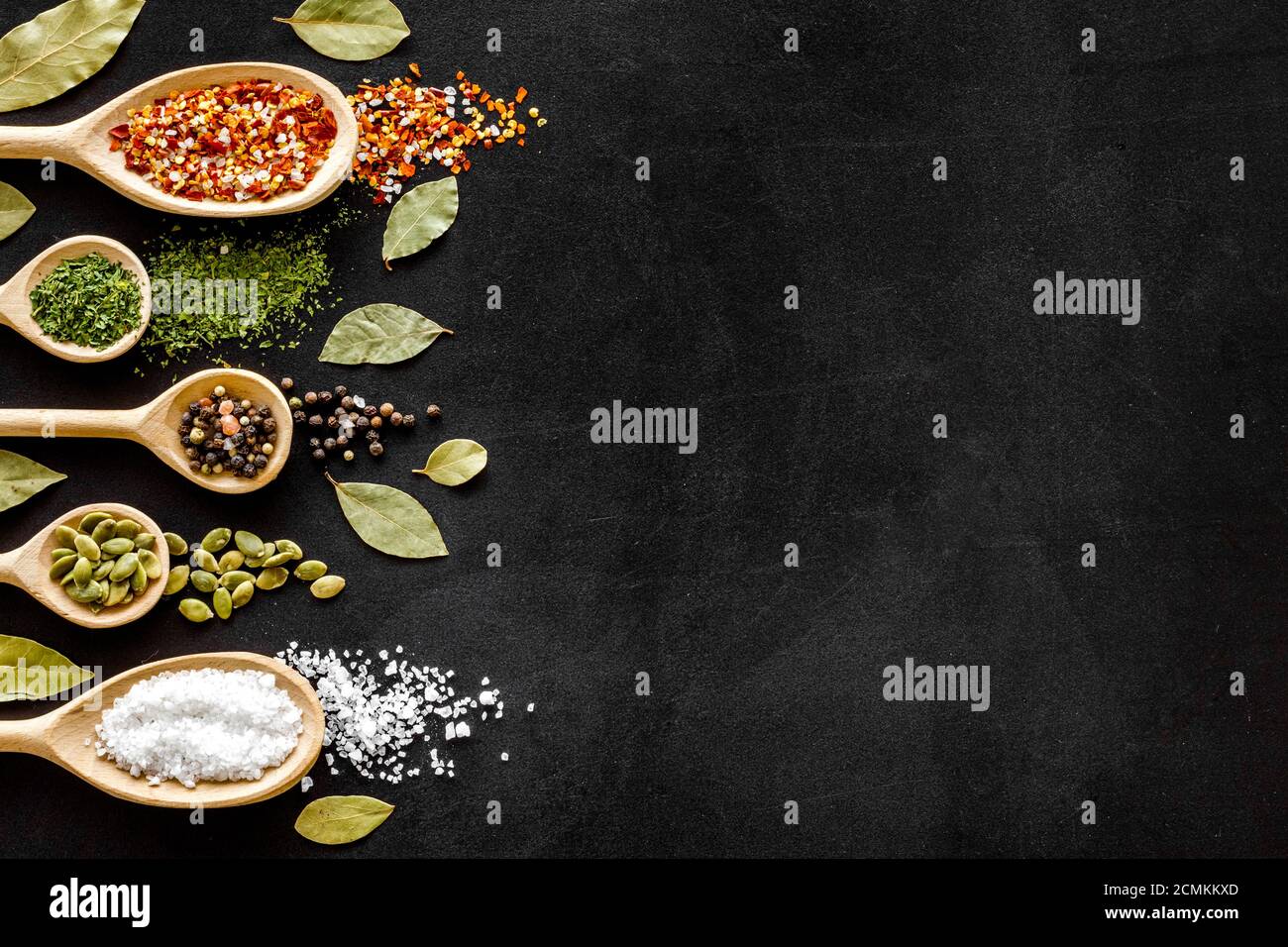 Layout of various spices in spoons. Top view, copy space Stock Photo ...
