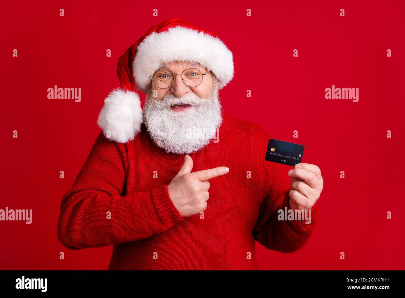 Best choice for x-mas wish dream gift buy payment. Old white grey hair  beard man in santa claus headwear point finger credit card wear sweater  jumper Stock Photo - Alamy