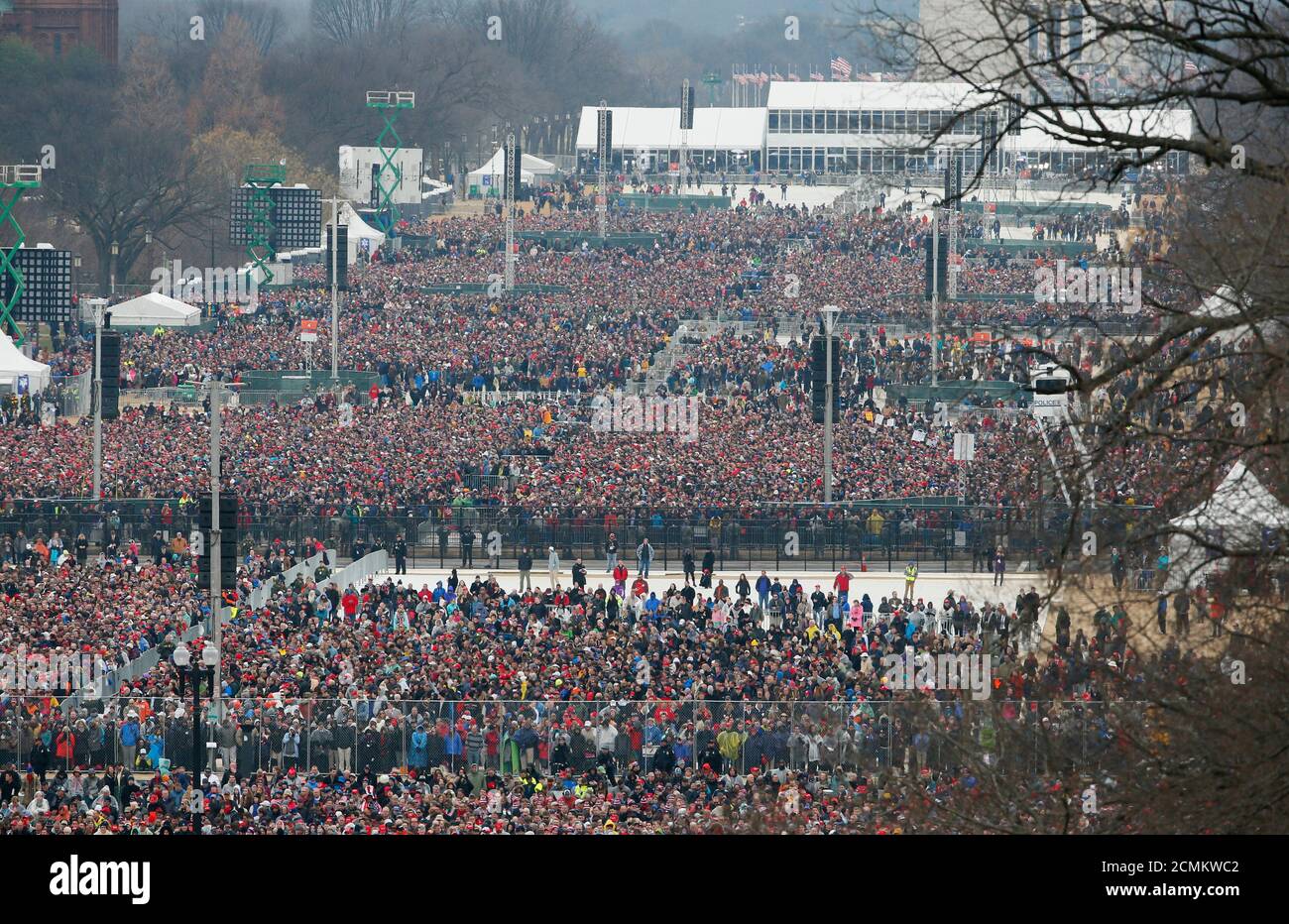 Crowds watch the inauguration ceremonies swearing in Donald Trump as the 45th president of the United States on the West front of the U.S. Capitol in Washington, U.S., January 20, 2017. REUTERS/Rick Wilking Stock Photo