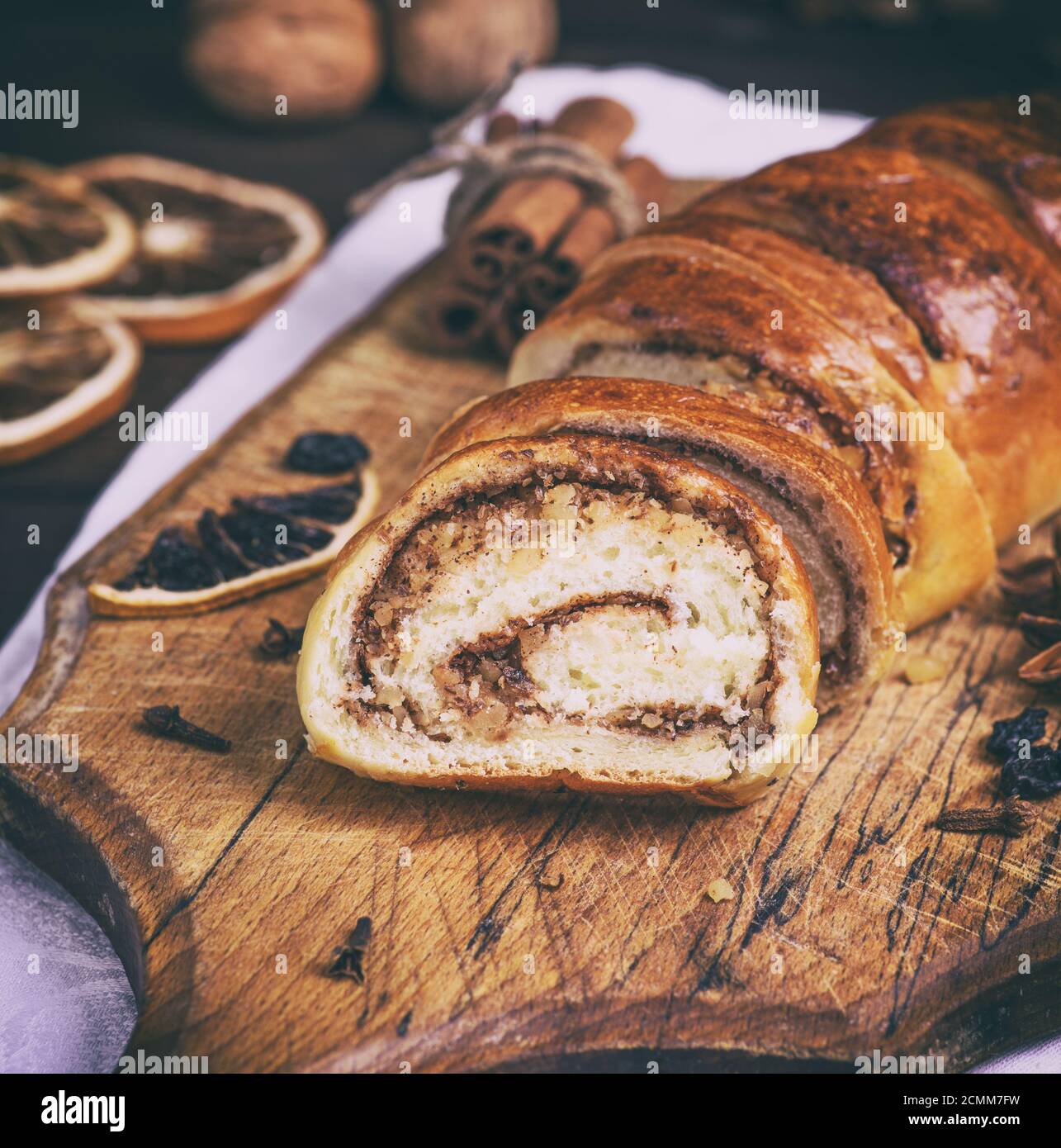 baked roll with cinnamon and nuts Stock Photo